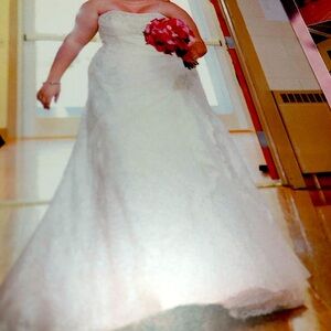 White wedding dress which was preserved and put in a box, corset straps